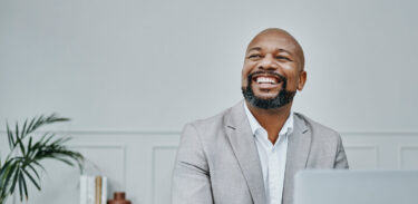 shot-of-a-mature-businessman-using-a-laptop-in-a-modern-office-2