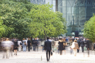 business-people-walking-in-a-financial-district-blurred-motion